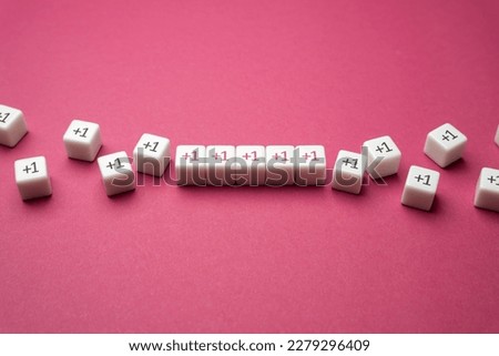 Growing row of blocks plus one. Get support, more help. Sequential addition to the sum. Increase and growth. Accumulation process. Continuation. Strengthening and growth in numbers. Joint efforts.