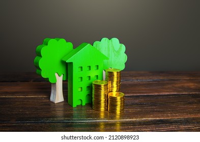 Growing stacks of coins and a green house. Economy and efficiency of green technology in housing. Investment grants and funding. Autonomy and self-sufficiency. Negative carbon footprint.