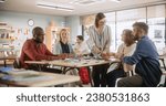 Grown Up Men and Women Working in Groups for an Assignment in Specialty Development Center. Adult Classmates Working on a Team Assignment, Young Female Teacher Explaining the Exercise Goals