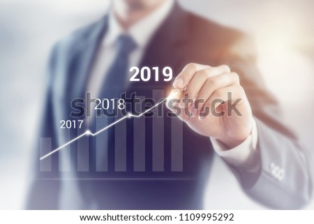 Growth in 2019 year concept. Businessman plan and increase of positive indicators in his business.