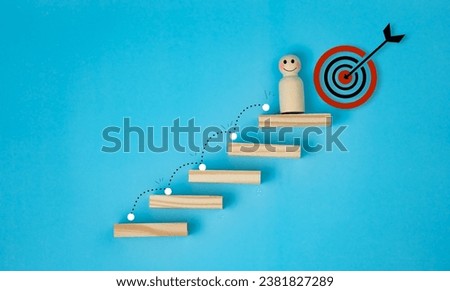 growth concept of business, goal oriented, successful, wooden male mannequin, standing on last step of stairs, with ultimate goal, on bright blue background, copy space.