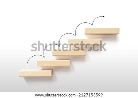 Growth or increase design concept. Cube block staircase moving step growing up to target on white background. Success achievement or goal business motivation