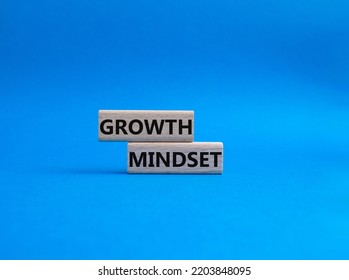 Growth Mindset symbol. Concept word Growth Mindset on wooden blocks. Beautiful blue background. Business and Growth Mindset concept. Copy space - Shutterstock ID 2203848095