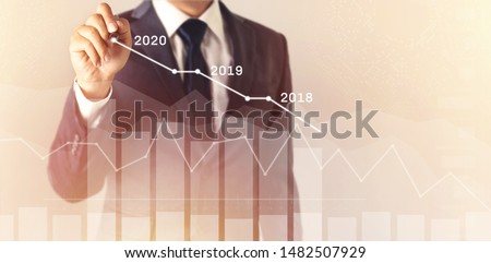 Growth success developments in 2020 concept. Businessman forecast analysis plan profit chart with pen and increase of positive indicators. graph business financial plan year 2018, 2019 to 2020.