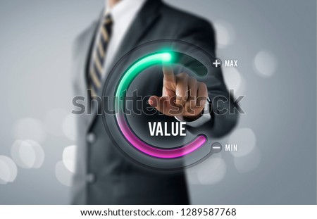 Growth value, increase value, value added or business growth concept. Businessman is pulling up circle progress bar with the word VALUE on bright tone background.