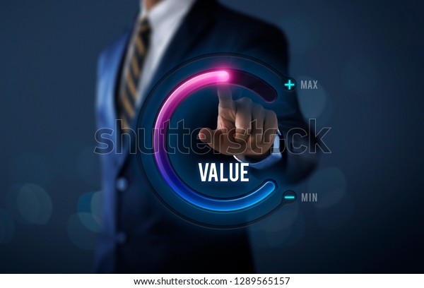 Growth value, increase value,\
value added or business growth concept. Businessman is pulling up\
circle progress bar with the word VALUE on dark tone\
background.