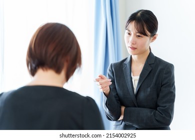 Grumpy Asian Businesswoman Scolding In The Office