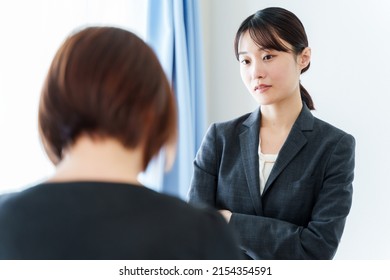 Grumpy Asian Businesswoman Scolding In The Office