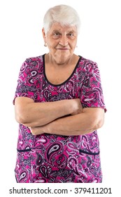 Grumpy elderly lady with arms crossed on white background