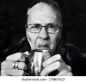 Grumpy Old Man With Mug Of Tea.