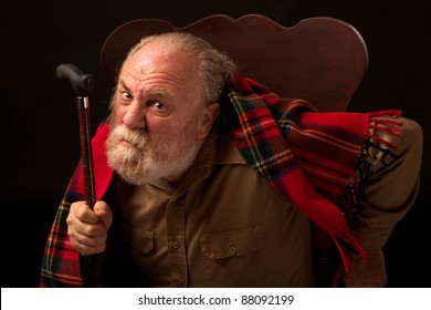 Grumpy Old Man Shakes Cane And Frowns