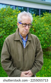 Grumpy old man in a weather jacket