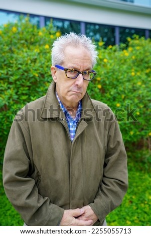 Grumpy old man in a weather jacket