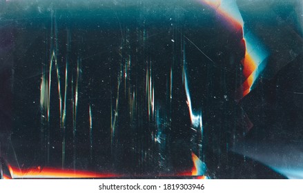 Grunge abstract background. Damaged screen. Orange glitch noise on blue scratched texture with dust.