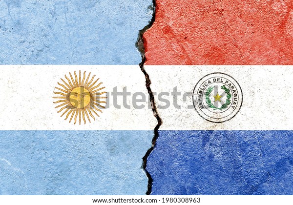 Grunge Argentine vs Paraguay national flags\
pattern isolated on broken cracked wall background, abstract\
Argentina Paraguay politics relationship friendship divided\
conflicts concept texture\
wallpaper