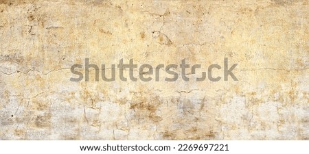Grunge background with old stucco wall texture of beige color