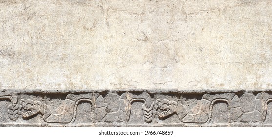 Grunge background with stone wall texture and bas-relief carving of a snake. Horizontal banner with copy space for text. Mock up template