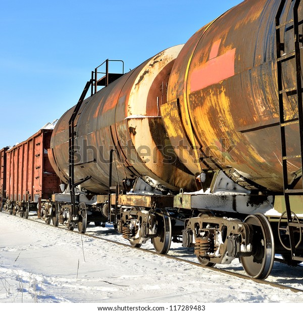 grunge cargo train on\
the move in winter