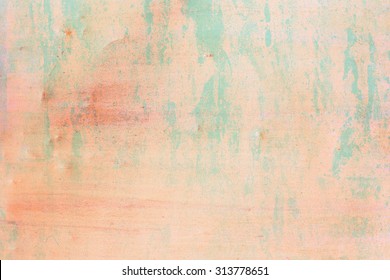 Grunge colorful backdrop. abstract light urban grunge background. Old scratched surface. Peach colour with blue splashes.