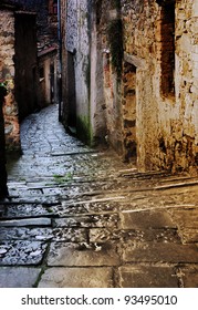grunge dark alley with staircase at night in the old tuscan village