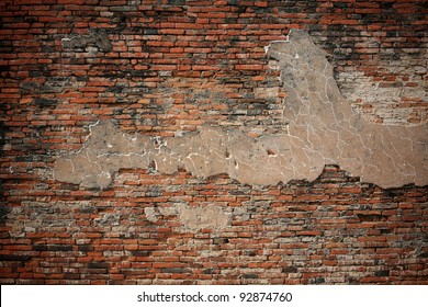 Grunge dirty old brick stone wall exterior on ancient temple architecture in Ayutthaya, Thailand. Weathered textured pattern background with copy space for text.