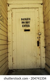 Grunge Do Not Enter Sign On Old Wooden Door Locked