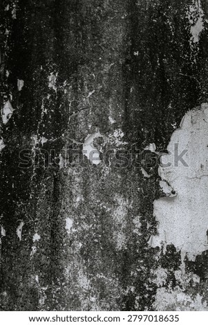 The grunge effect of peeling and worn wall paint.