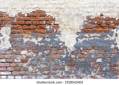 Grunge empty red stonewall background. Old brick wall texture. Painted distressed wall surface. Weathered building facade with old damaged plaster. Grungy brickwall