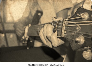 Grunge Image Of Young Woman Hand Playing Electric Guitar,Old Paper