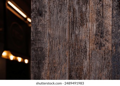 A grunge look old wooden textured wall with empty copy space. The wood board panel mockup is for logo and text for advertising.