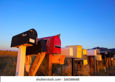 Grunge mail boxes in a row at Arizona desert USA - Powered by Shutterstock