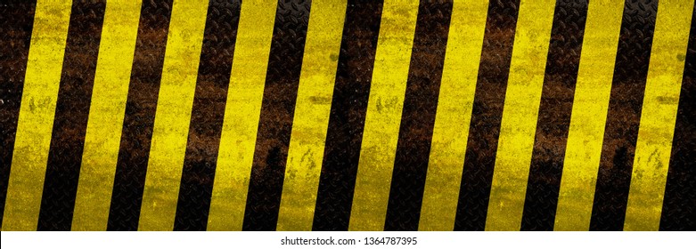 Grunge metal yellow hazard stripe texture background for wide banner