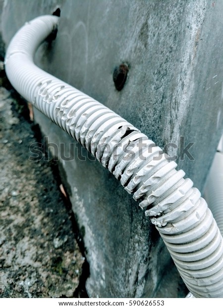 Grunge
plastic corrugated pipe. Black and white
photo