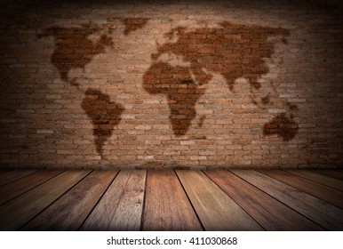 Grunge Room Decorated With  World Map On Red Brick Wall And Wooden Floor Background