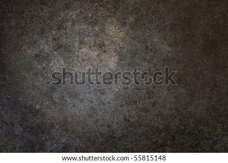 Grunge rust metal surface with vignette.