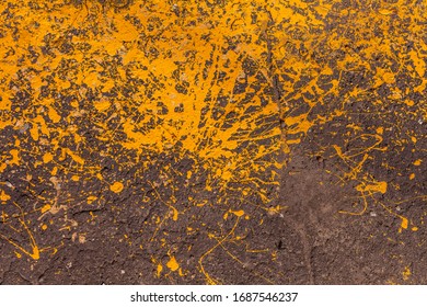 Grunge street urban texture with bright orange paint splatters