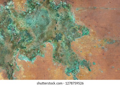 Grunge texture of verdigris oxidized on the surface of copper or brass as a background