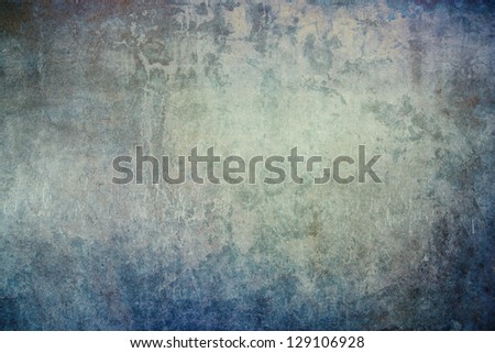 Grunge, textured concrete wall with subtle blue, grey, green and brown hues.