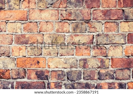 Grunge urban background of a brick wall with slight cross process effect