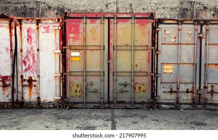 Grunge urban interior with old metal cargo containers 