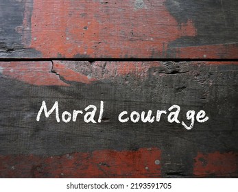 Grunge Vintage Wall With Handwritten Text MORAL COURAGE, Means Courage To Take Action For Moral Reasons Or Act Upon Ethical Values To Help Others During Difficult Ethical Dilemmas