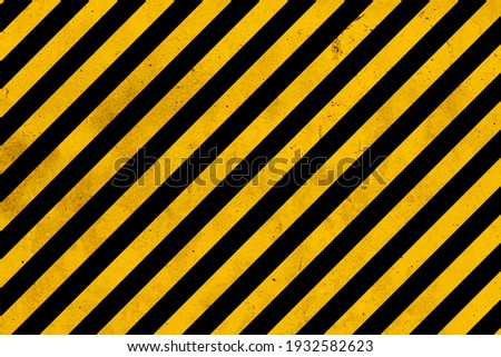 Grunge yellow and black diagonal stripes. Industrial warning background, warn caution, construction, safety