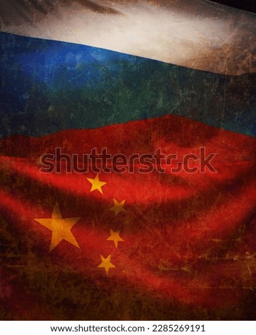 Grunged waving flags of Russia and China.