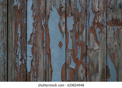 Grungy blue and red pealing paint wooden wall texture