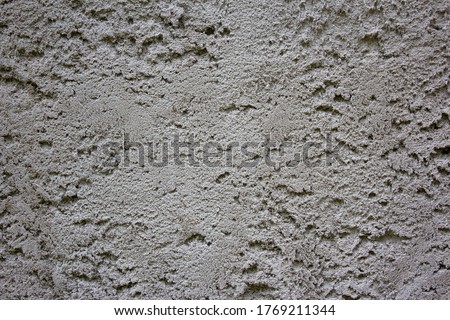 Grungy dark concrete wall for background. Cement texture use for background. Background of cement plaster. Covering the basement of the walls of houses with cement mortar. Construction technologies. ストックフォト © 