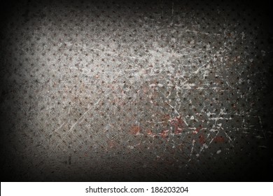 grungy distressed metal surface with many small holes