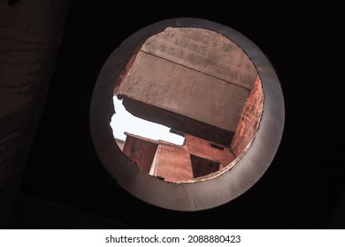 Grungy Industrial Interior With Round Light Window In Ceiling Of The Abandoned Unfinished Nuclear Power Plant At The Cape Kazantyp, Crimea