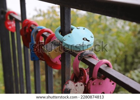 Grungy metal love padlocks with heart decoration. Traditional heart-shaped lock as a symbol of eternal love.