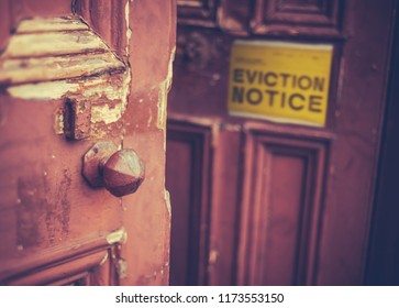 Grungy Old Door With A Yellow Eviction Notice - Shutterstock ID 1173553150