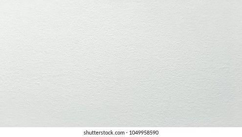 Grungy painted wall texture as background. Cracked concrete vintage wall background, old white painted wall. Background washed painting